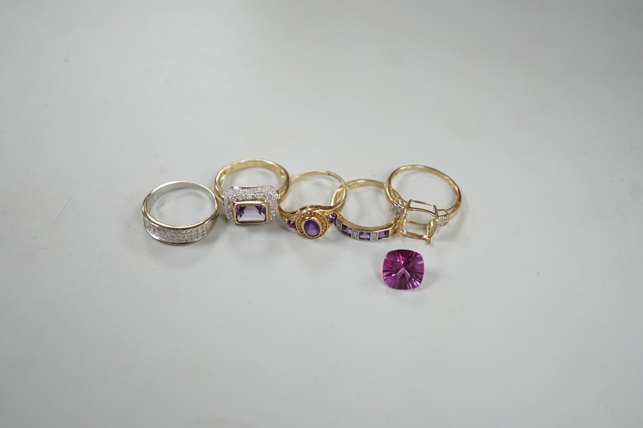 Five assorted modern 9ct gold and gem set dress rings, including diamond chip half hoop and amethyst and diamond chip half hoop, gross weight 12.6 grams.